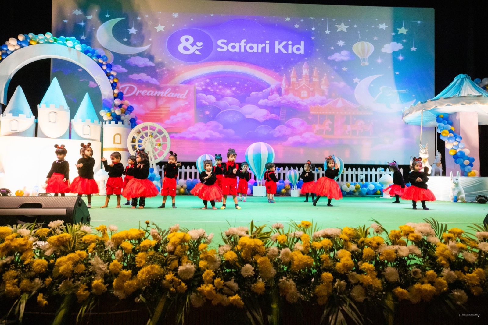 Children performing on stage at Safari Kid Annual Day
