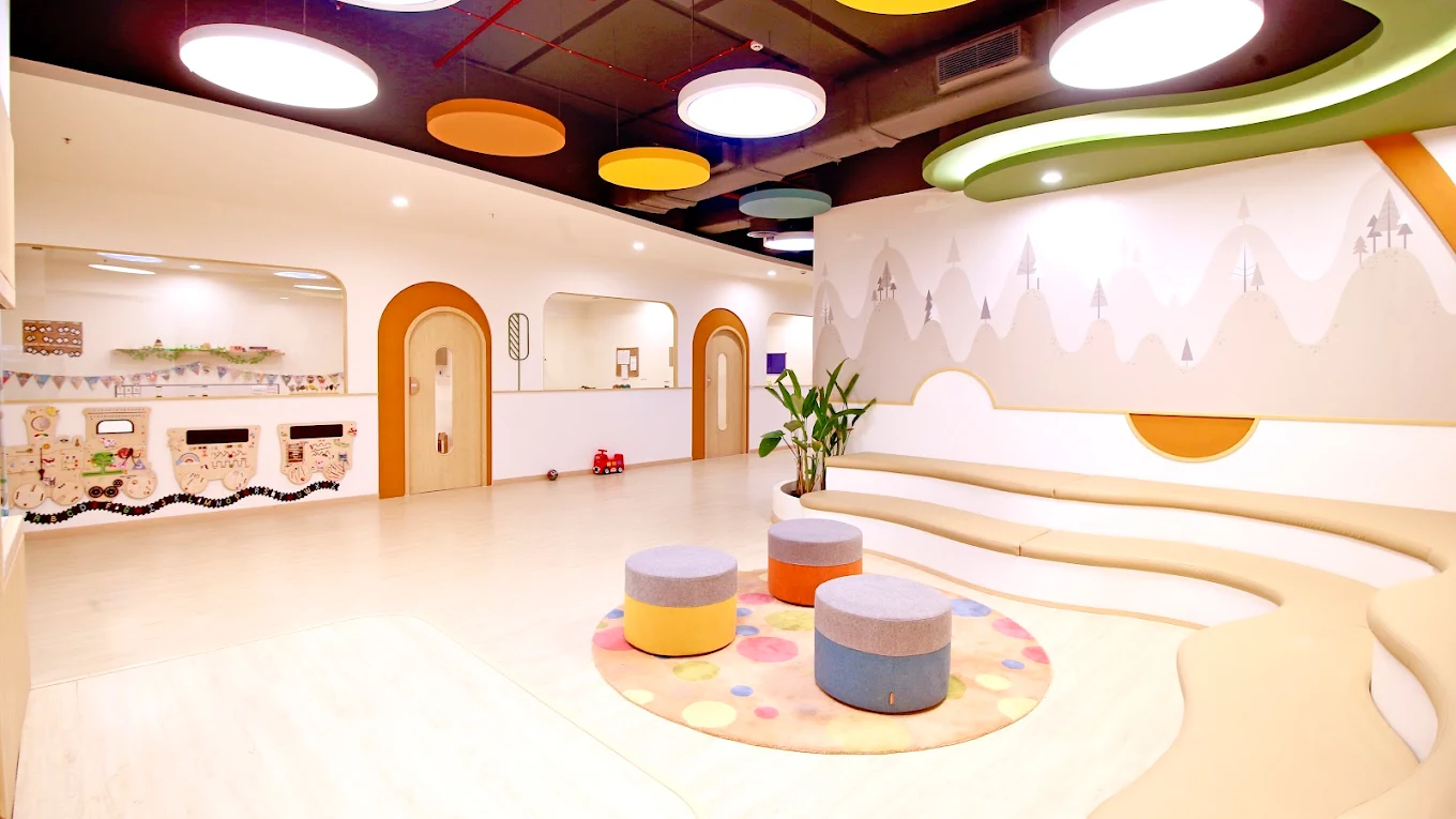 Safari Kid Financial District - Colorful play area with mountain mural